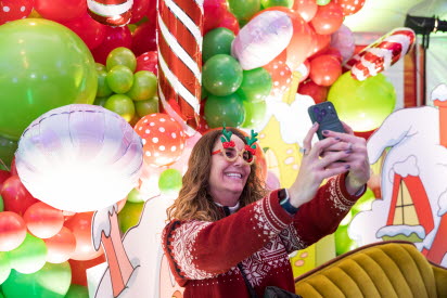 Woman taking a selfie at the Whoville Winter Celebration at Greenfield